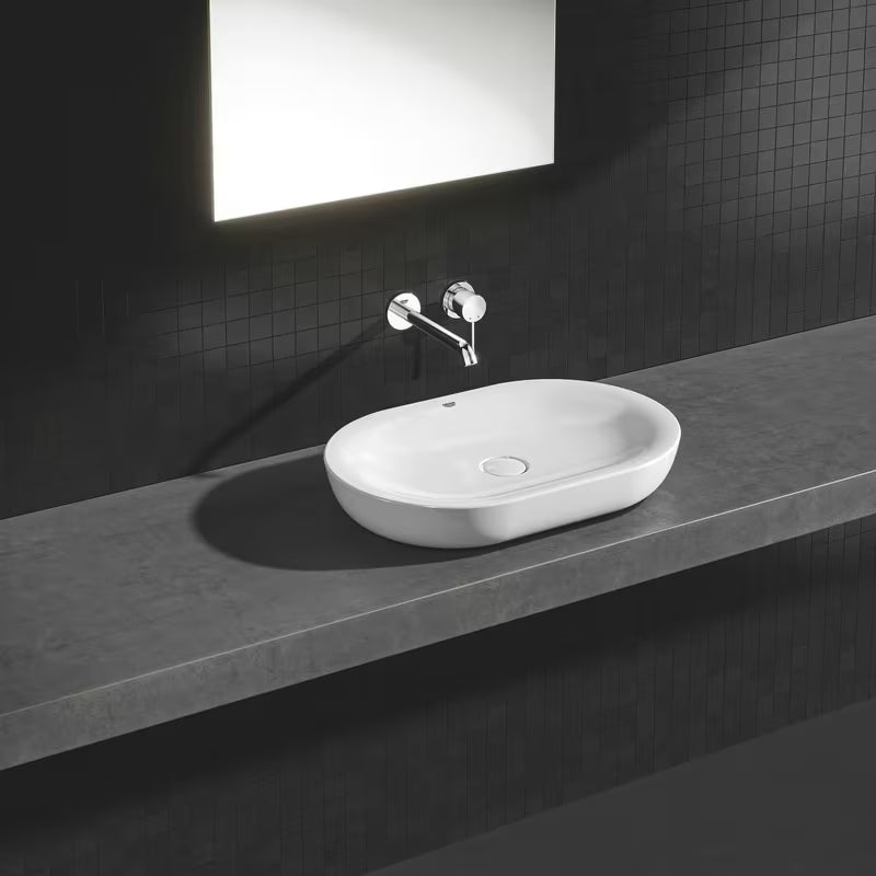 Kromirana podometna armatura za umivalnik Grohe Essence New pro za stensko montažo z ročico in rozeto.