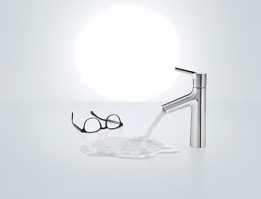 Kromirana enoročna armatura za umivalnik Hansgrohe Talis s odvodnim setom