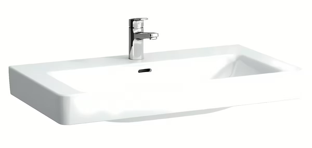 Pohištveni umivalnik Laufen Pro S 85x46 cm od sjajne bijele keramike s otvorom pro slavinu u sredini.