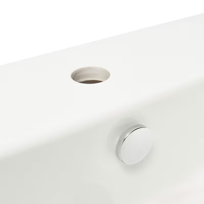 Beli viseče keramični umivalnik vitra Integra 55x45 cm z odprtino pro za armaturo na sredini in prelivom.