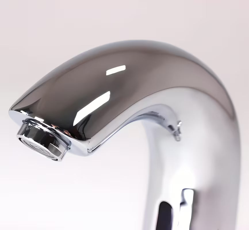 Kromirana senzorska armatura za umivalnik Weltservis Donner s infracrvenim aktiviranjem i ručicom za regulaciju temperature.