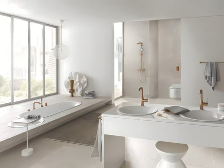Enoročna stoječa armatura za umivalnik Grohe Essence z odtokom v mat barvi warm sunset.