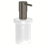 Dozirnik za Milo Grohe Essentials brez držala s stekleno posodico in površino Grohe StarLight v izvedbi hard graphite.