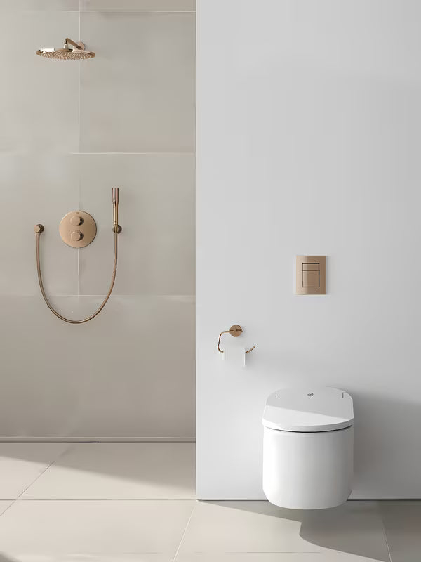 Držalo za toaletni Papir Grohe Essentials brez pokrova v obdelavi warm sunset s skritim pritrjevanjem