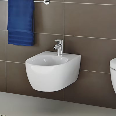 Kromirana armatura za bide Grohe Eurostyle Cosmopolitan z odtokom in ročnim upravljanjem.