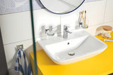 Kovinski kavelj Grohe Start Cube Accessories v krom izvedbi s skritim pritrjevanjem.