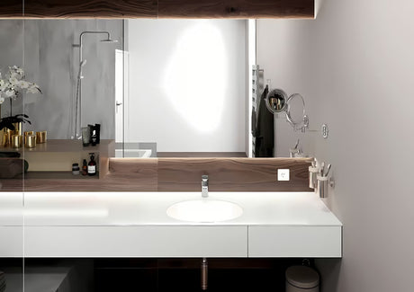 Kromirana enoročna armatura za umivalnik Hansgrohe Vernis Blend 100 z odtokom in potezno palico.