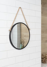 Okruglo metalno ogledalo Naturel promjera 40 cm u mat crnoj boji, obješeno na čvrsto uže.