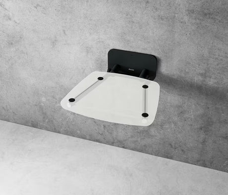 Zložljivo sedež za tuš Ravak Ovo B II s crnom konstrukcijom i prozirnim sjedalom Clear u četvrtastoj izvedbi.