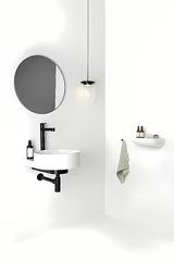 Bijeli keramički viseči umivalnik Ravak Yard 40 brez preliva s otvorom pro za stojeću slavinu.