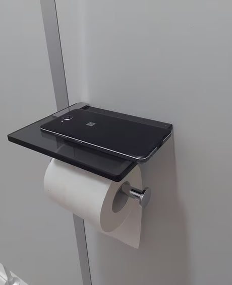 Črn držalo za toaletni papir SAT Cube Way z odlagalno polico iz kaljenega varnostnega stekla.
