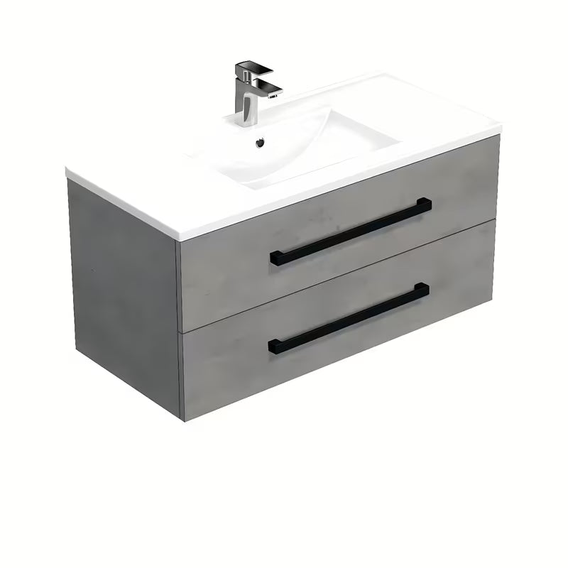 Viseča kopalniška omarica SAT Cube Way s keramičkim umivaonikom u dekoru betona i crnim ručkicama.