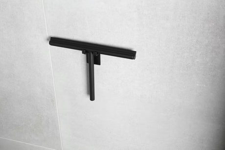 Črn kavelj SAT z minimalističnim dizajnom pro montaža brez vrtanja s trakom 3M