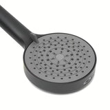 Mat crna ručna tuš slušalica SAT s okruglom glavom promjera 12 cm i četiri vrste mlaza.