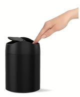 Črn namizni koš za smeti Simplehuman Mini s preklopnim pokrovom in prostornino 1,5 l.