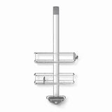 Tuš polica Simplehuman Shower caddy iz nerjavnih materialov z nastavljivimi policami in priseski pro za stabilno pritrditev.