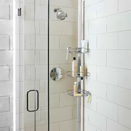 Nastavljiv tuš palica Simplehuman Shower caddy z žičnatimi policami kotna  v izvedbi iz nerjavnega jekla.