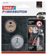 Kromiran kavelj Tesa powerbutton pro montaža brez vrtanja na ploščice in druge gladke površine.