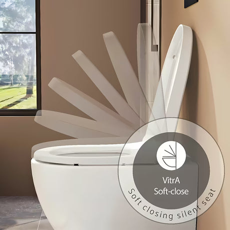 Bela WC deska Vitra Integra iz duroplasta z mehko Zapiranje Soft Close in kovinskimi tečaji s skritim pritrjevanjem.