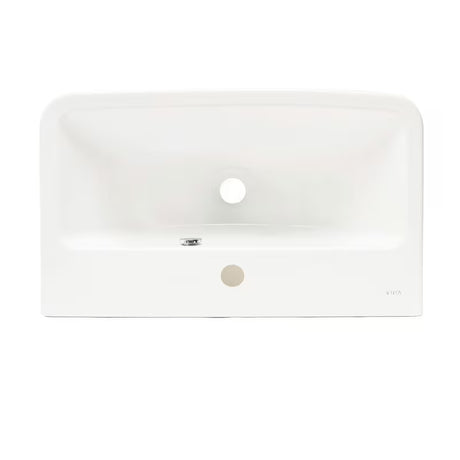 Beli viseči umivalnik Vitra Integra 60x36 cm iz keramike z odprtino pro za armaturo na sredini in prelivom.