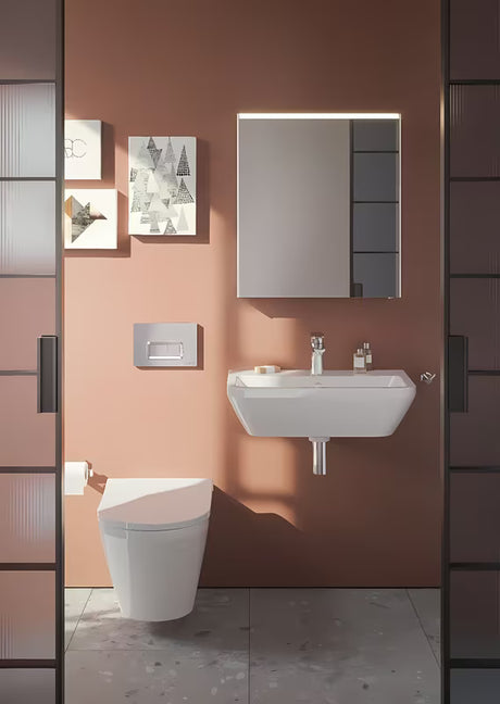 Beli viseči umivalnik Vitra Integra 60x36 cm iz keramike z odprtino pro za armaturo na sredini in prelivom.
