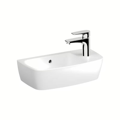 Bel keramični umivalnik na ploščo Vitra Shift New 50 x 25 cm s prelivom in odprtino za pro armaturo na desni.